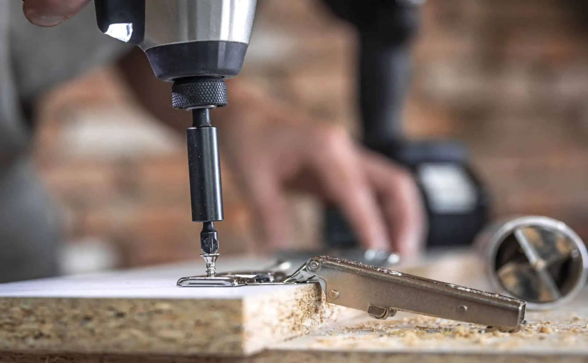 screwing-self-tapping-screw-into-metal-fastening-hole-wood-strip-using-screwdriver-work-carpenter-1