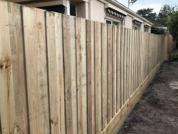 fence down the side of a house